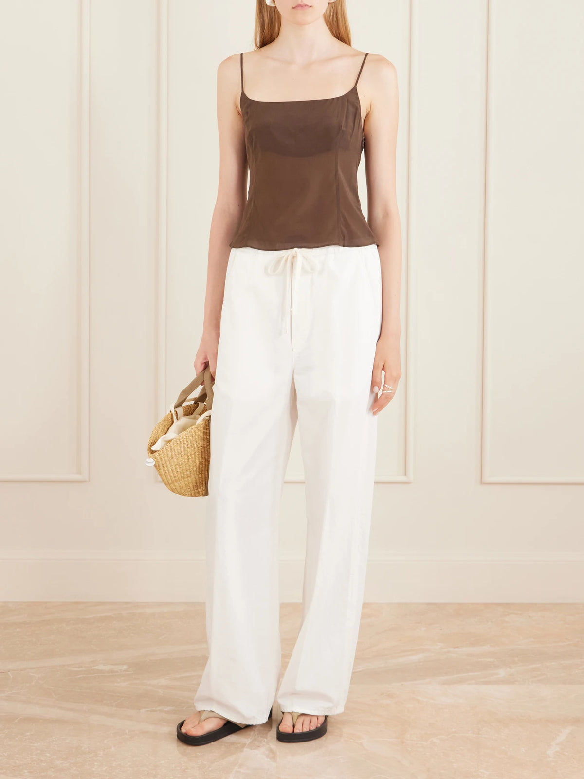 Image of a model wearing Tops. Product name - Stretch Satin Cami in Brown colour by brand - ST. AGNI