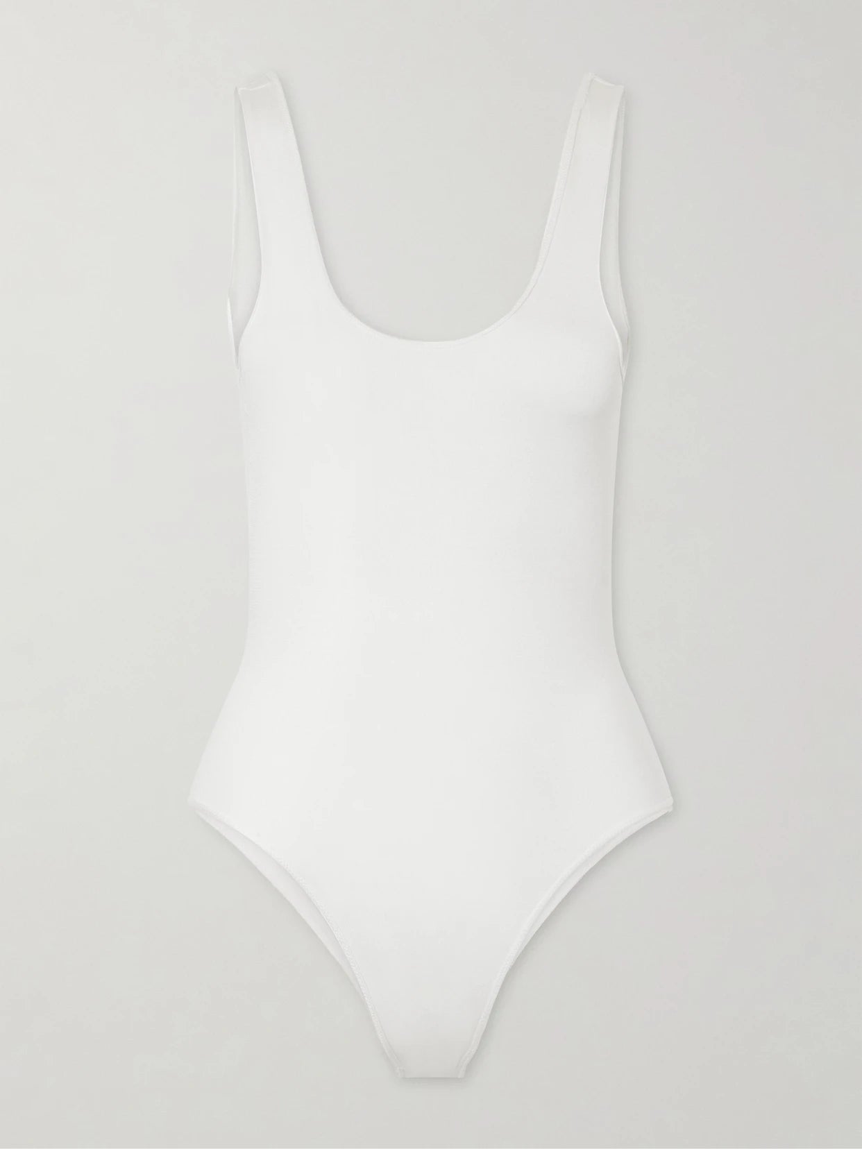 Image of a model wearing Tops. Product name - Silk-blend Bodysuit in White colour by brand - Alaïa