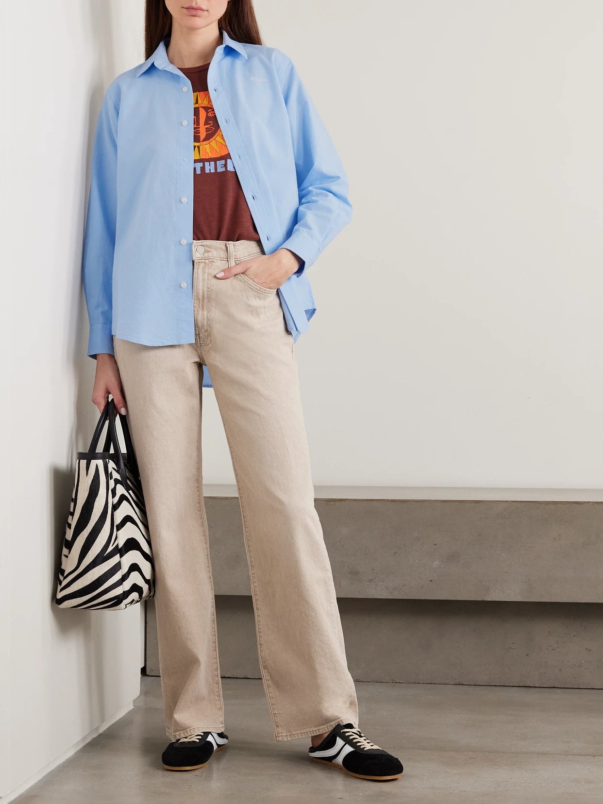 Image of a model wearing Tops. Product name - The Bestie Embroidered Cotton Shirt in Light blue colour by brand - Mother