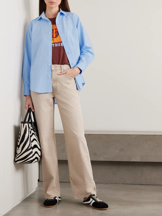 Image of a model wearing Tops. Product name - The Bestie Embroidered Cotton Shirt in Light blue colour by brand - Mother