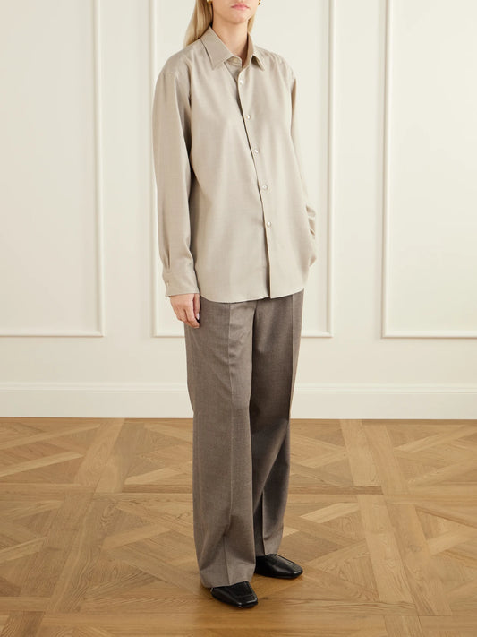 Image of a model wearing Tops. Product name - Wool Shirt in Beige colour by brand - Auralee