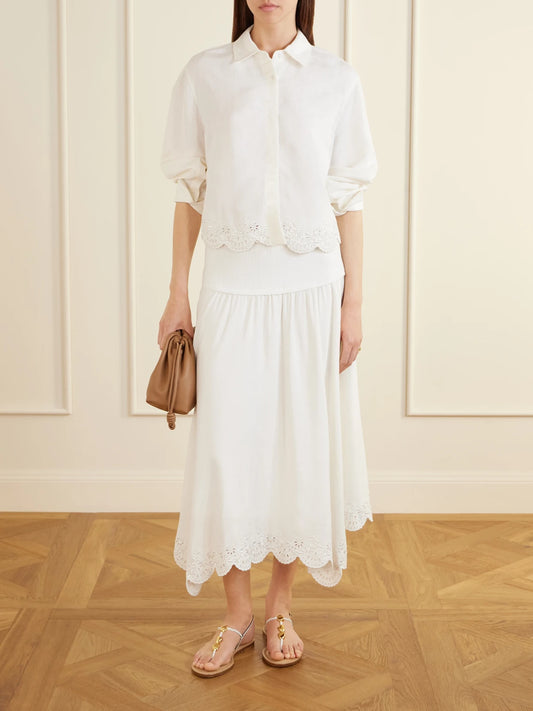 Image of a model wearing Tops. Product name - Ames Cropped Broderie Anglaise Linen-blend Shirt in White colour by brand - SIMKHAI