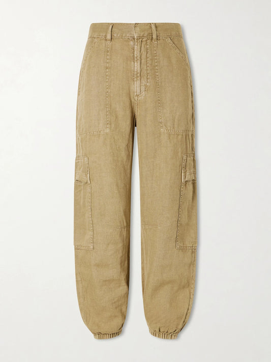 Image of a model wearing Pants. Product name - Ciela Linen Tapered Pants in Beige colour by brand - Citizens of Humanity