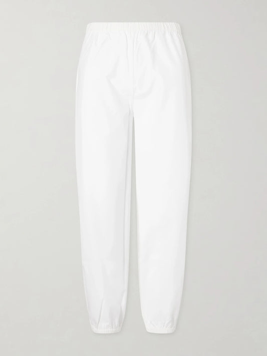 Image of a model wearing Pants. Product name - Delos Cotton-poplin Balloon Pants in White colour by brand - Suzie Kondi