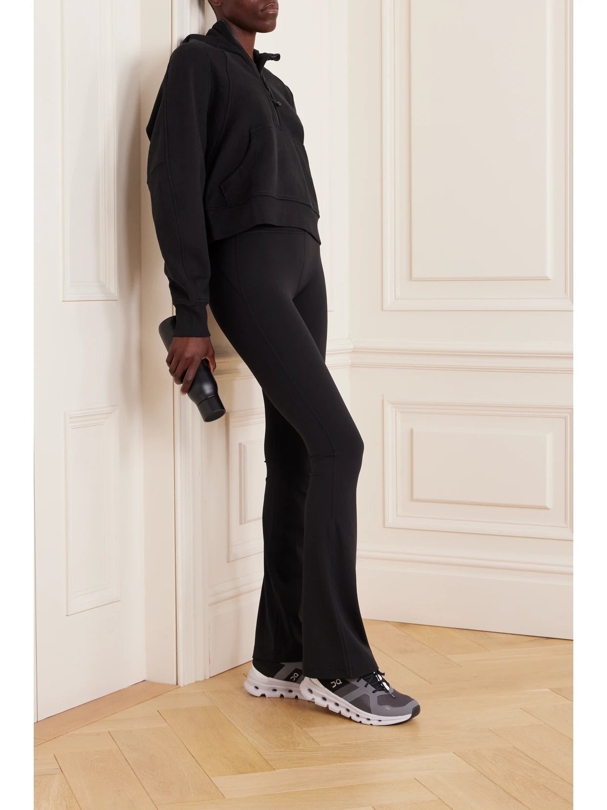 Image of a model wearing Pants. Product name - Groove Stretch Flared Pants in Black colour by brand - lululemon