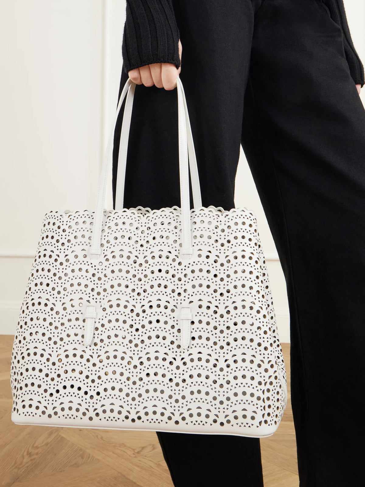 Image of Bags. Product name - Mina Laser-cut Leather Tote in Off-white colour by brand - Alaïa