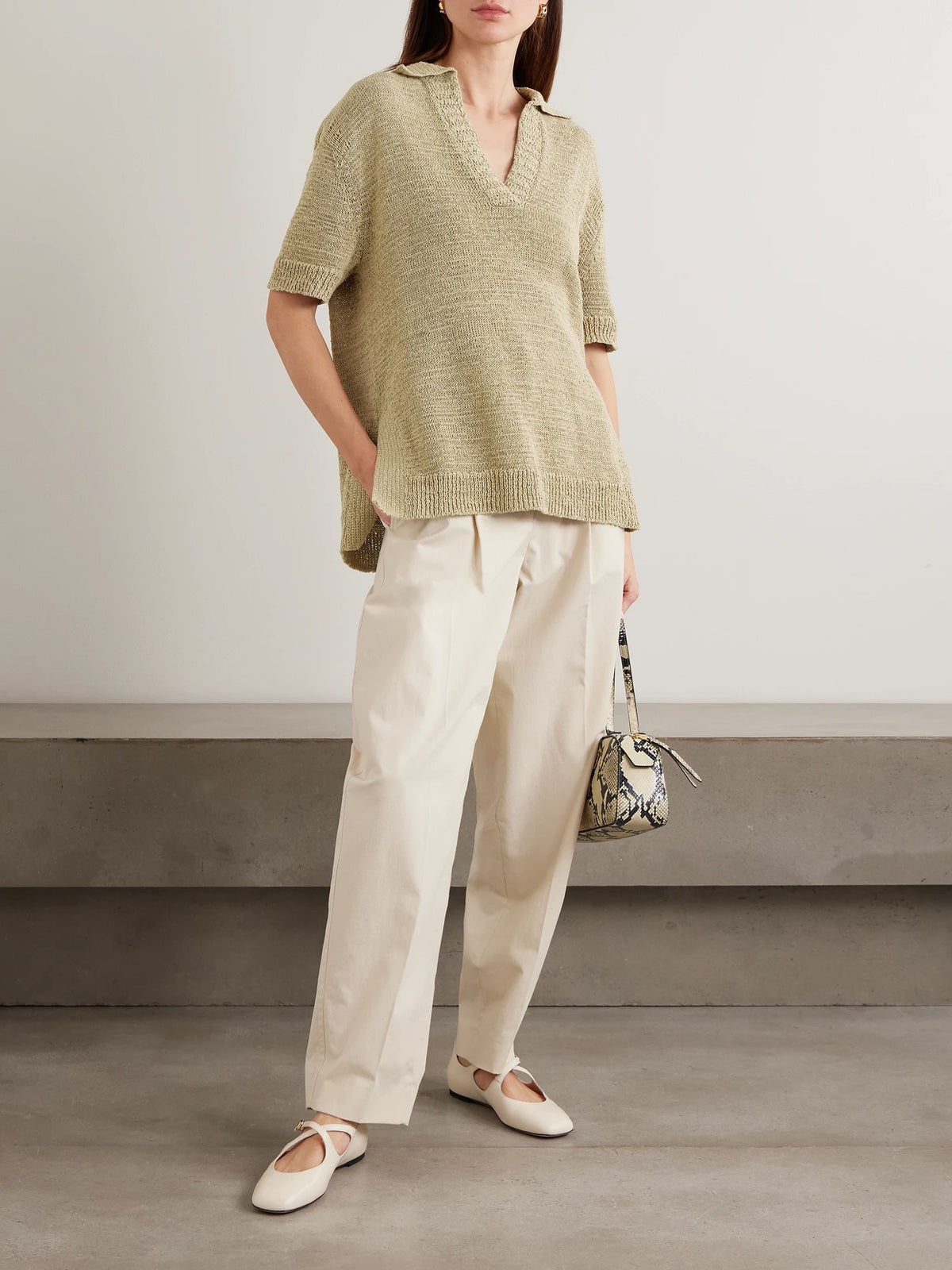 Image of a model wearing Outerwear. Product name - Rian Knitted Polo Shirt in Army green colour by brand - Joseph