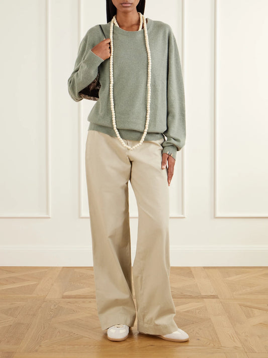 Image of a model wearing Outerwear. Product name - Bis Cashmere Sweater in Sage green colour by brand - Extreme Cashmere