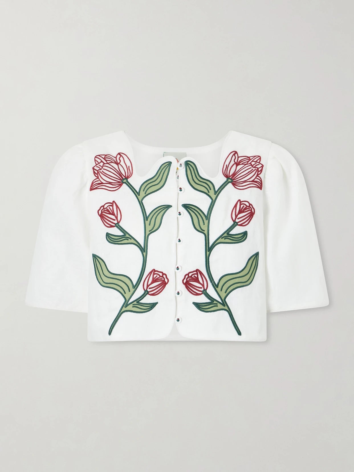 Image of a model wearing Tops. Product name - Floral-embroidered Cropped Linen Top in Off-white colour by brand - Farm Rio
