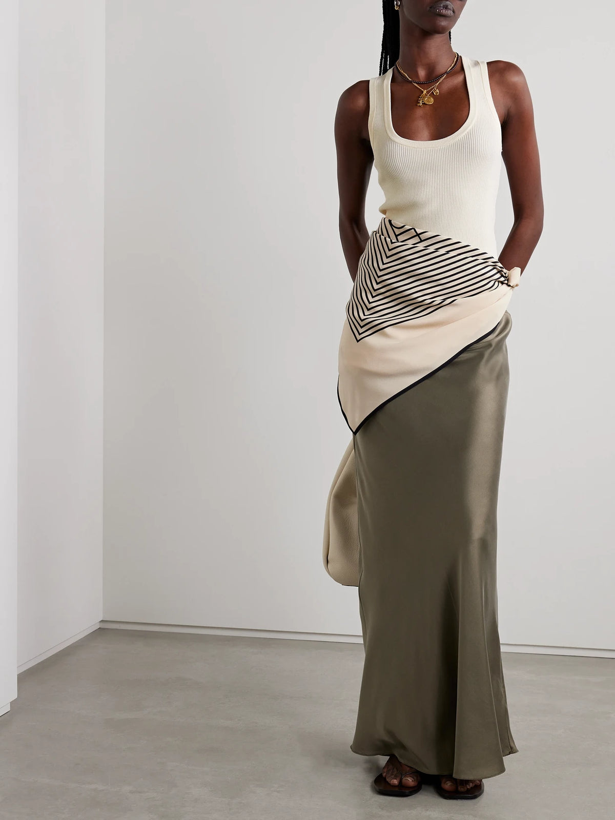Image of a model wearing Tops. Product name - Ribbed-knit Tank in Ecru colour by brand - Matteau