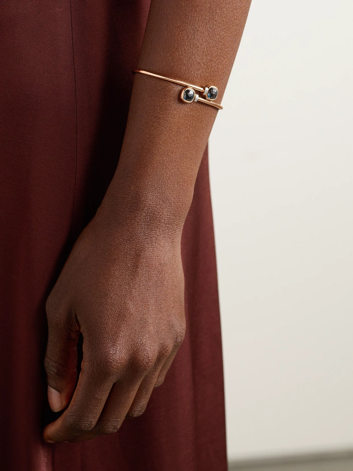 Image of Bracelets. Product name - Mini Nudo 18-karat Rose And White Gold, Topaz And Diamond Bangle in Multi colour by brand - Pomellato