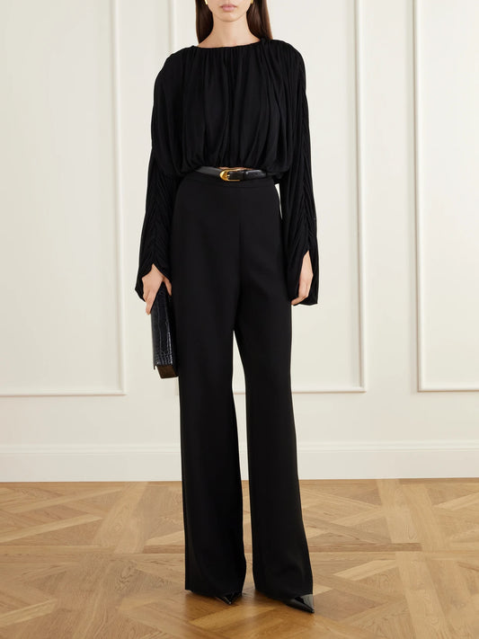 Image of a model wearing Tops. Product name - Micka Jersey Draped Blouse in Black colour by brand - Heirlome