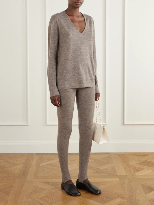 Image of a model wearing Pants. Product name - Merino Wool-blend Stirrup Leggings in Gray, Black colour by brand - Lauren Manoogian