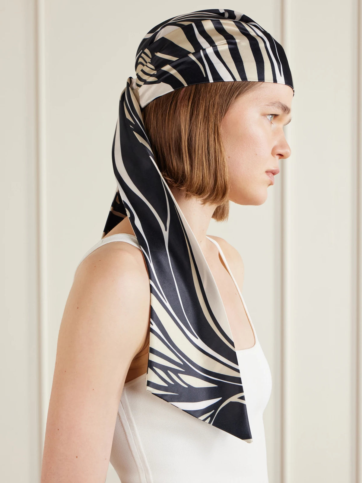 Image of Hats. Product name - Gigi Wave-printed Satin Scarf in Black colour by brand - Eugenia Kim