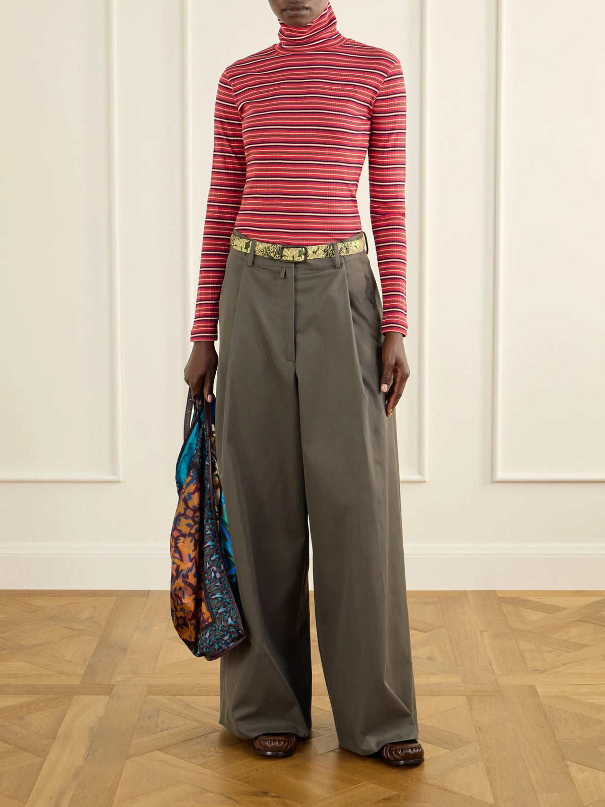 Image of a model wearing Pants. Product name - Cotton-twill Wide-leg Pants in Army green colour by brand - Dries Van Noten