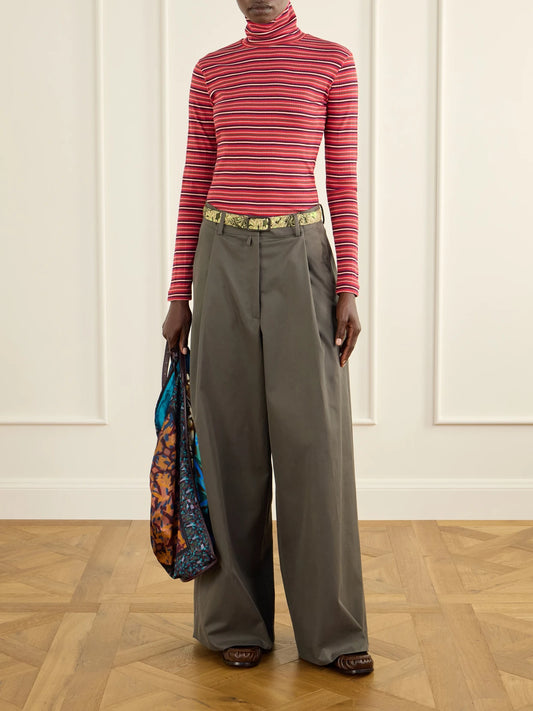 Image of a model wearing Pants. Product name - Cotton-twill Wide-leg Pants in Army green colour by brand - Dries Van Noten