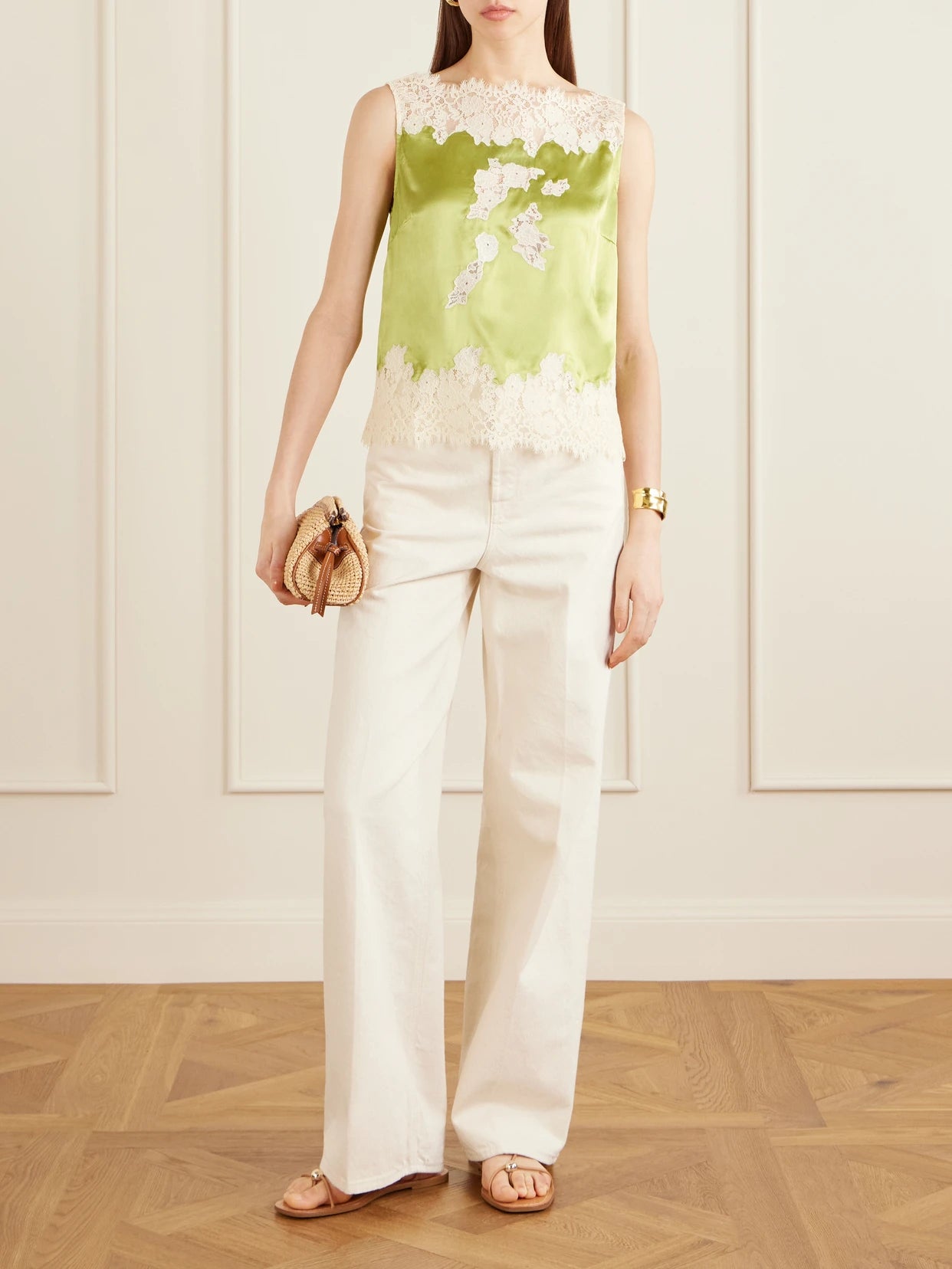 Image of a model wearing Tops. Product name - Viviane Lace-trimmed Silk-satin Top in Green colour by brand - DÔEN