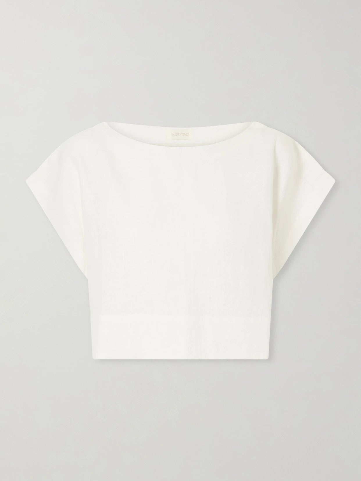 Image of a model wearing Tops. Product name - Kori Cropped Linen Top in White colour by brand - Suzie Kondi