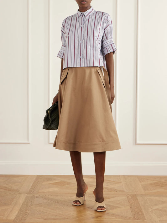 Image of a model wearing Skirts. Product name - Pure Intentions Belted Cotton-drill Midi Skirt in Light brown colour by brand - TWP