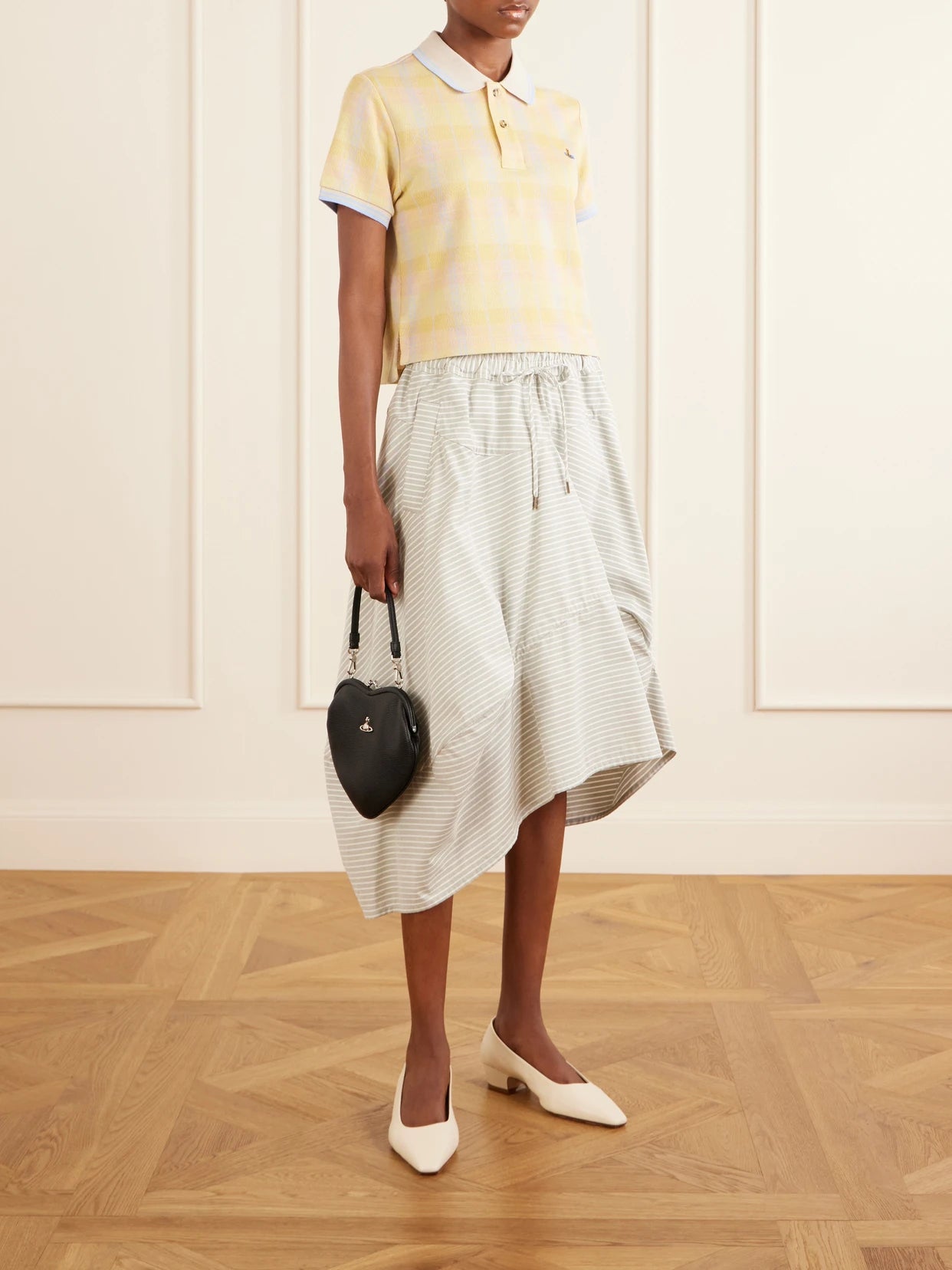 Image of a model wearing Outerwear. Product name - Logo-embroidered Checked Cotton-piqué Polo Shirt in Yellow colour by brand - Vivienne Westwood