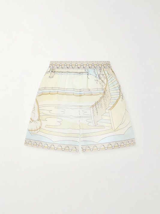 Image of a model wearing Shorts. Product name - Printed Cotton Shorts in Beige colour by brand - Tory Burch
