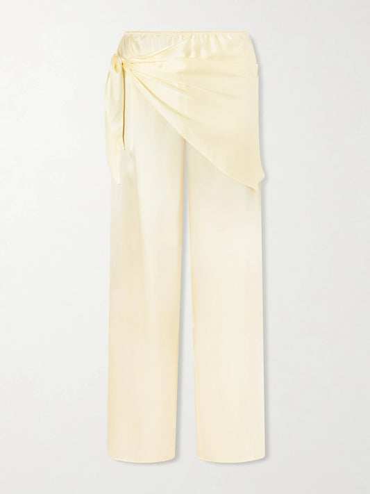 Image of a model wearing Pants. Product name - Lavona Tie-detailed Silk-satin Wide-leg Pants in Yellow colour by brand - DÔEN