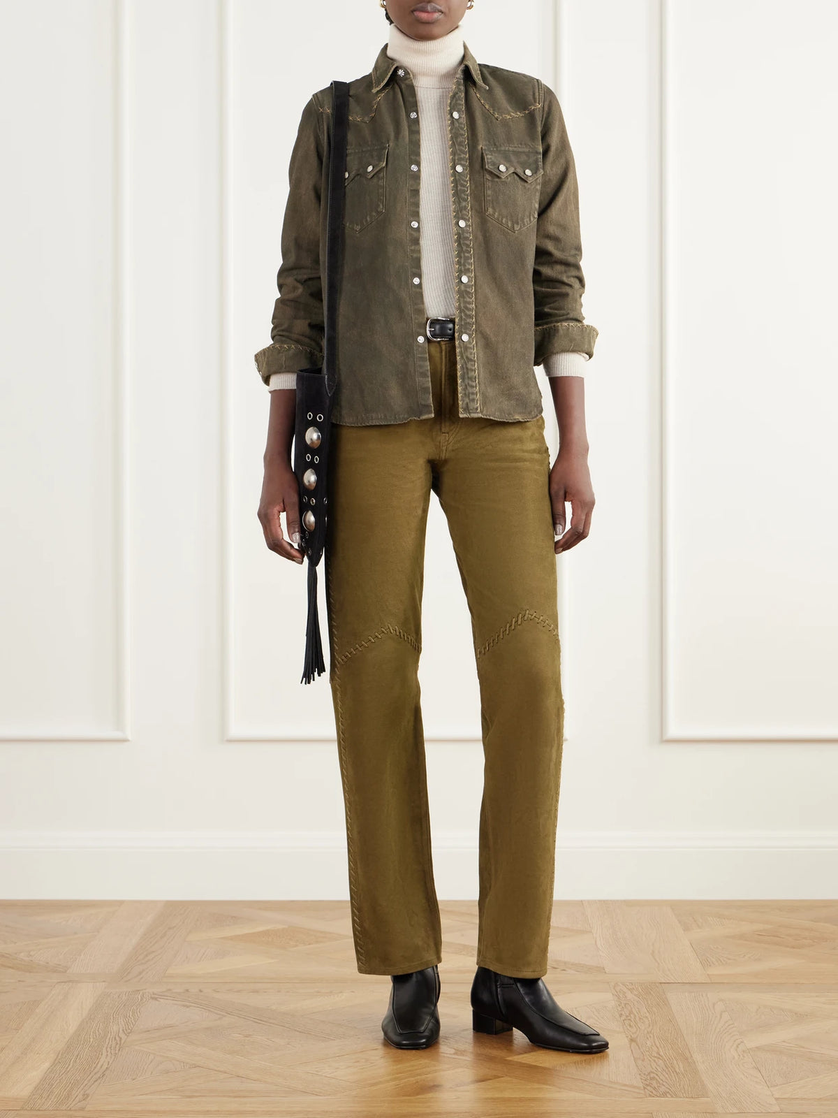 Image of a model wearing Pants. Product name - Paneled Whipstitched Paneled Suede Slim-fit Pants in Brown colour by brand - RRL