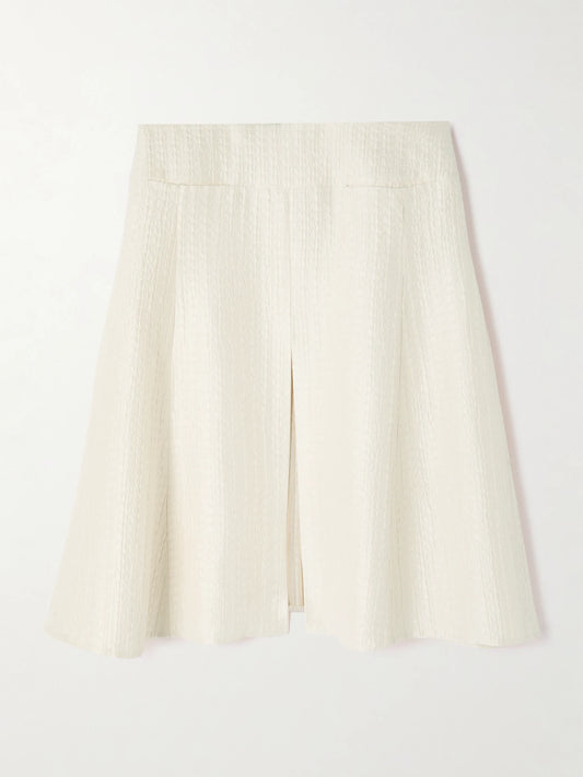 Image of a model wearing Skirts. Product name - Silk-cloqué Midi Skirt in Ivory colour by brand - Alaïa