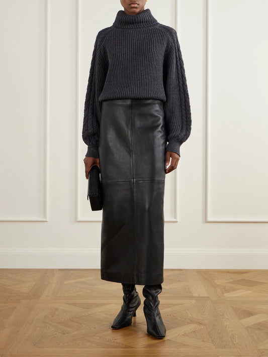 Image of a model wearing Outerwear. Product name - Alodina Ribbed Wool Turtleneck Sweater in Charcoal colour by brand - Joseph