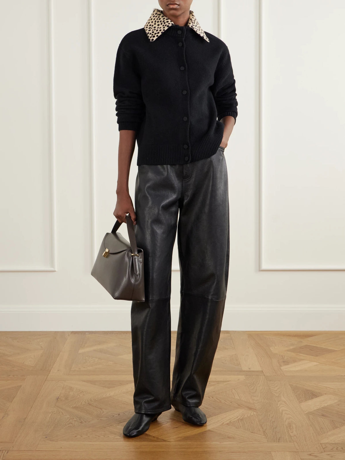 Image of a model wearing Outerwear. Product name - Calf Hair-trimmed Wool-blend Cardigan in Black colour by brand - RÓHE