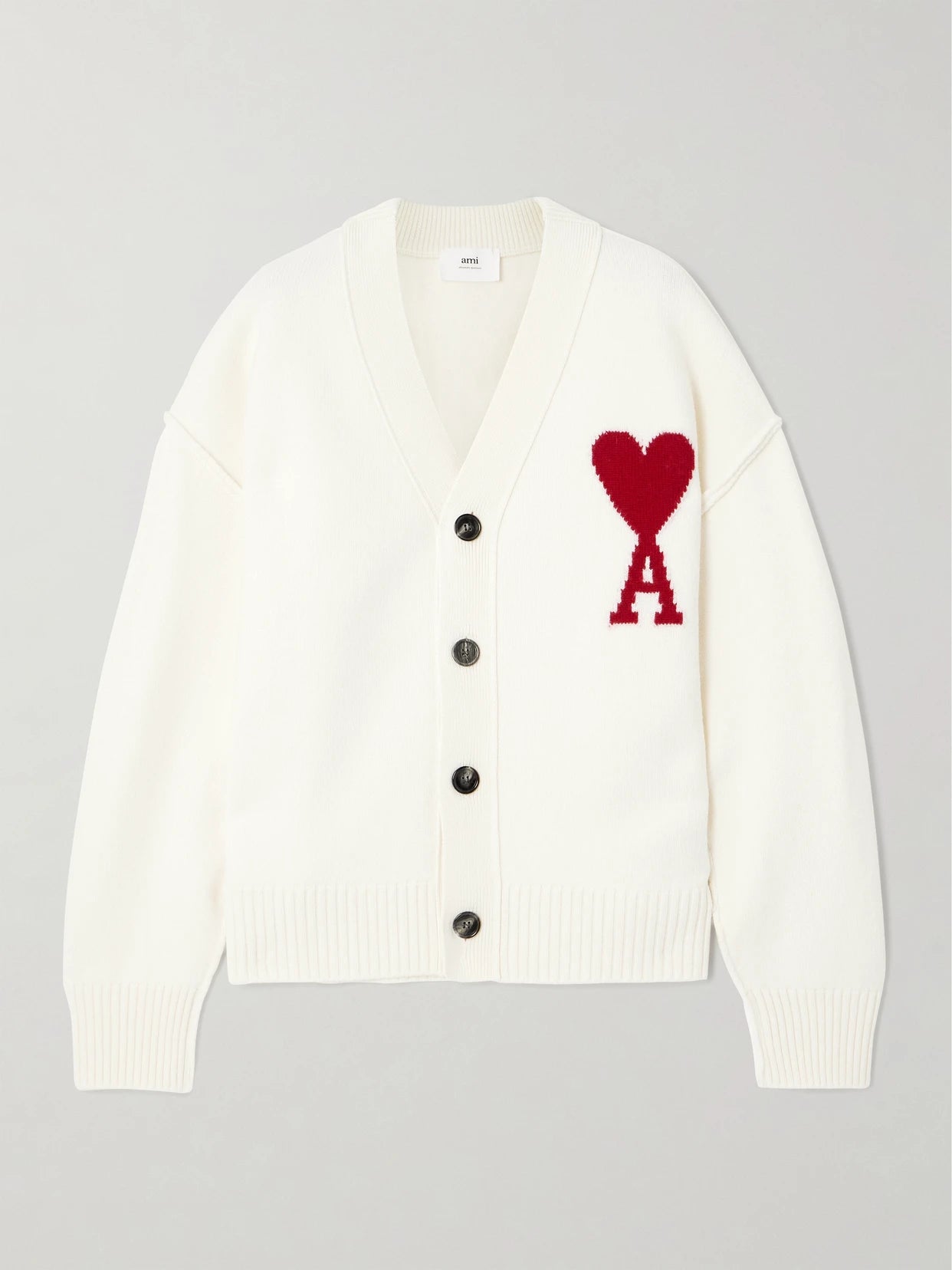 Image of a model wearing Outerwear. Product name - Adc Intarsia Merino Wool Cardigan in Off-white colour by brand - AMI PARIS
