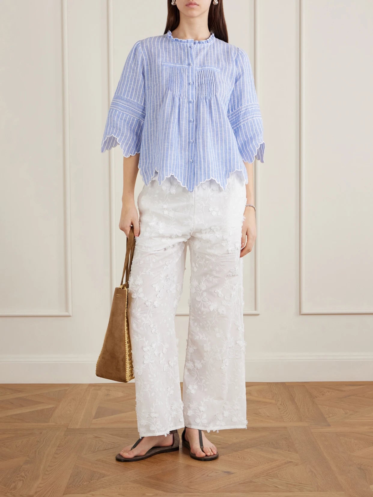 Image of a model wearing Tops. Product name - Matilde Scalloped Shirred Striped Linen Shirt in Blue colour by brand - Loretta Caponi