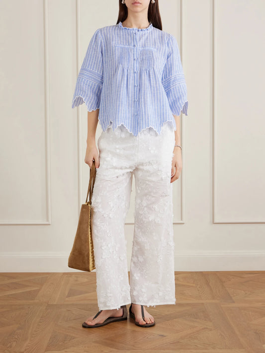 Image of a model wearing Tops. Product name - Matilde Scalloped Shirred Striped Linen Shirt in Blue colour by brand - Loretta Caponi