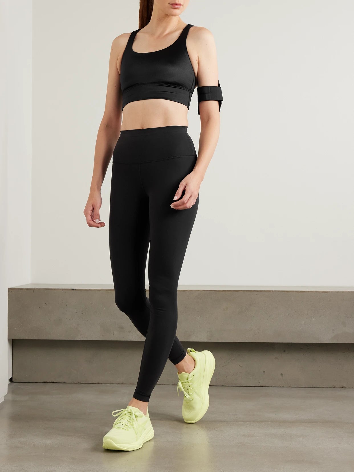 Image of a model wearing Pants. Product name - Wunder Train 28" Everlux High-rise Leggings in Black colour by brand - lululemon