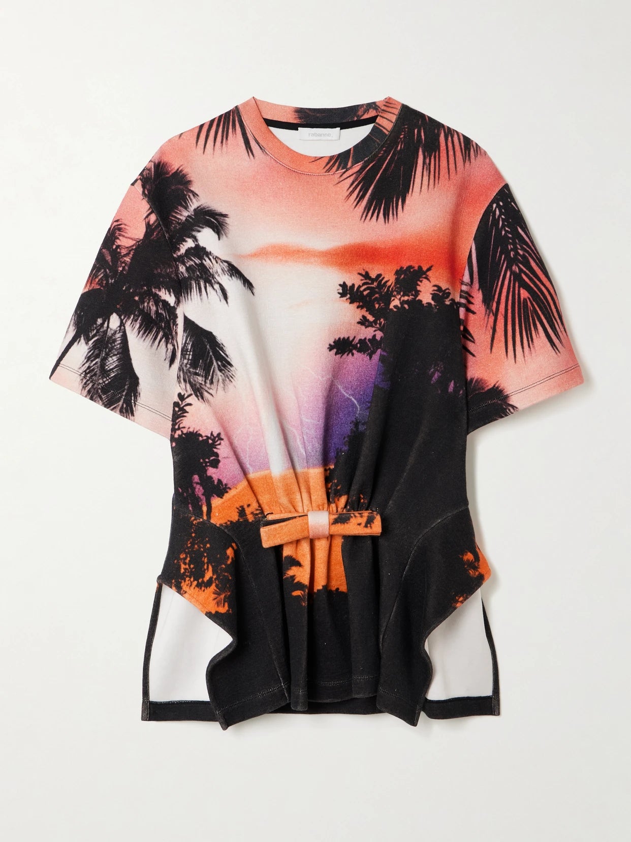 Image of a model wearing Tops. Product name - Bow-detailed Printed Gathered Jersey T-shirt in Multi colour by brand - RABANNE