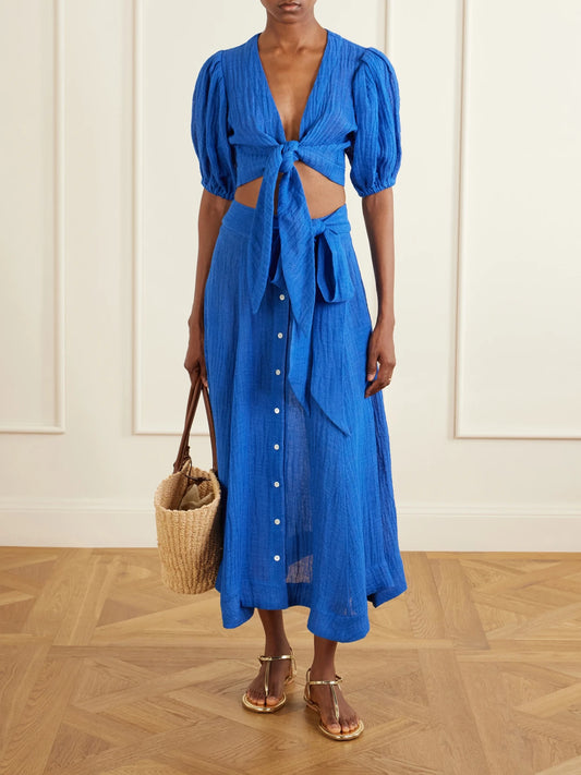 Image of a model wearing Skirts. Product name - Linen-blend Midi Skirt in Blue colour by brand - Lisa Marie Fernandez
