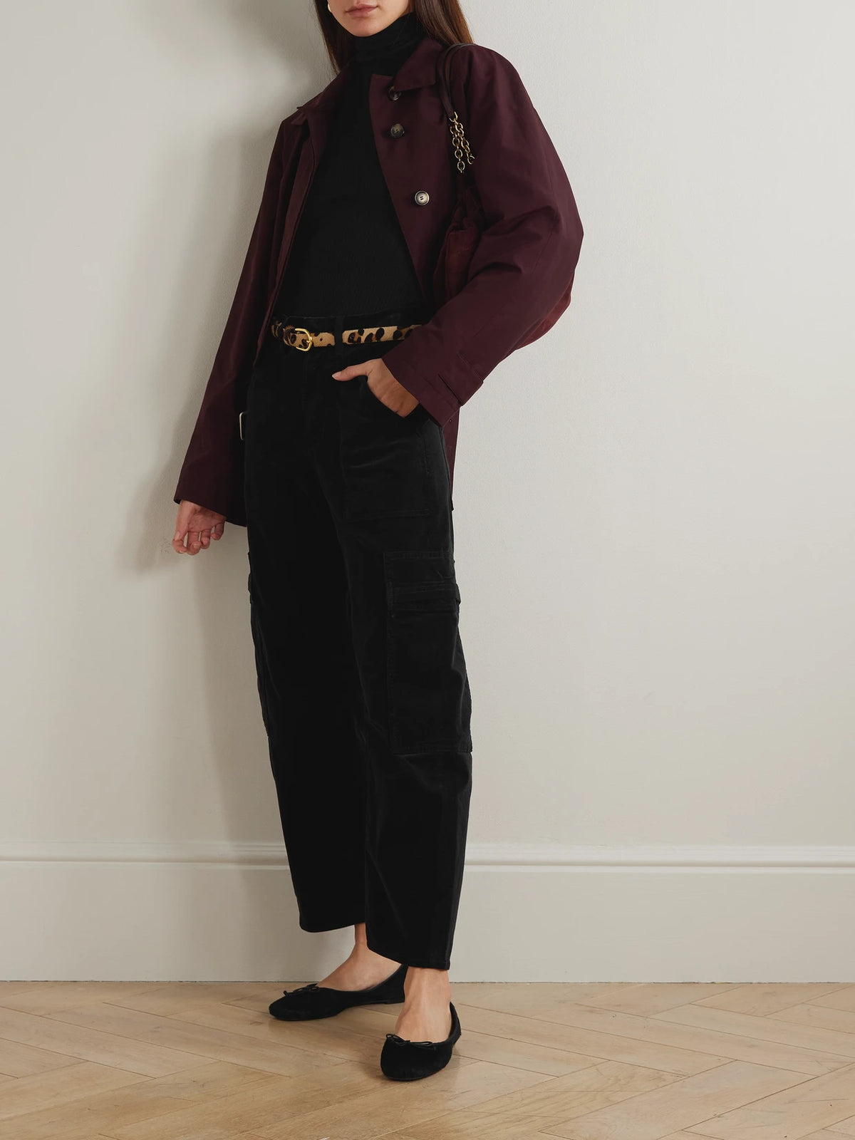 Image of a model wearing Tops. Product name - Caradene Ribbed Stretch-lyocell Turtleneck Sweater in Black colour by brand - Citizens of Humanity