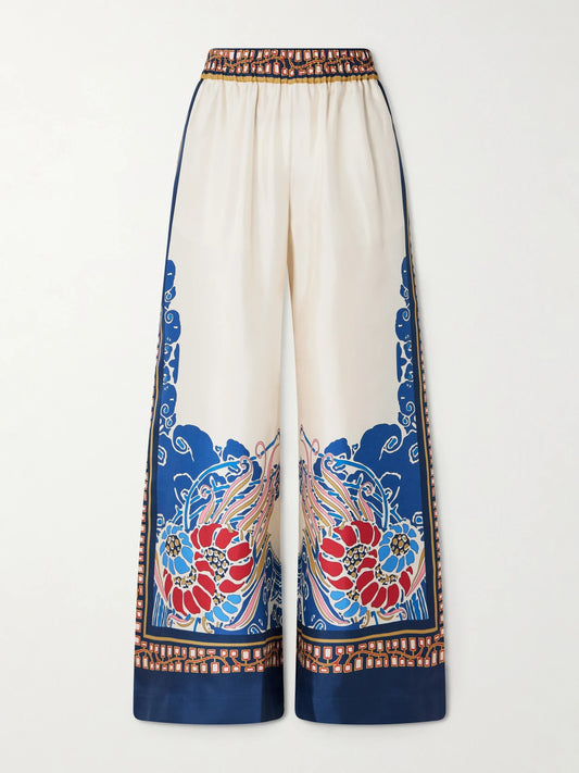 Image of a model wearing Pants. Product name - Printed Silk-twill Wide-leg Pants in Cream colour by brand - La DoubleJ