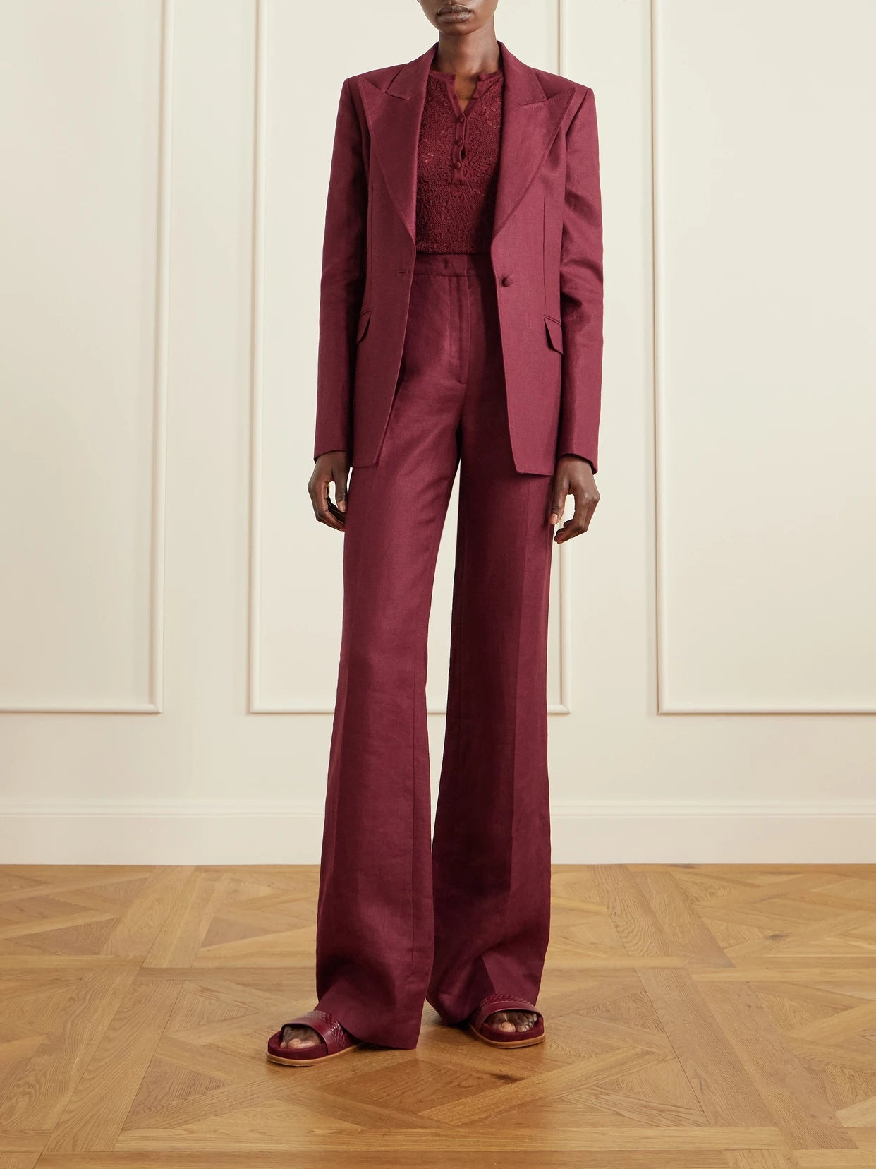 Image of a model wearing Outerwear. Product name - Leiva Linen-twill Blazer in Burgundy colour by brand - Gabriela Hearst