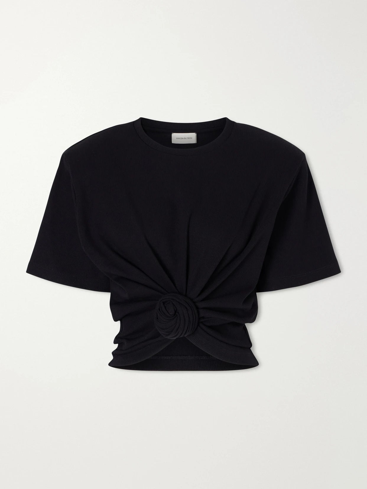 Image of a model wearing Tops. Product name - Gathered Ribbed Cotton-blend T-shirt in Black colour by brand - Magda Butrym