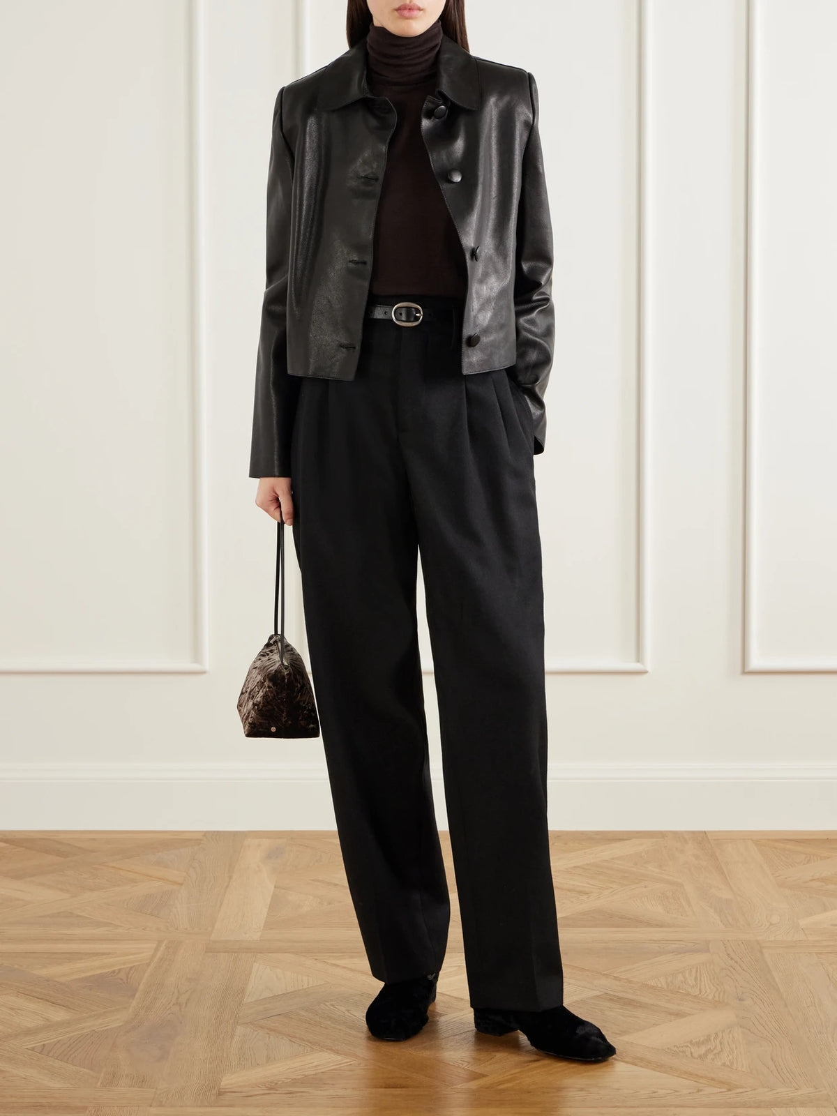 Image of a model wearing Outerwear. Product name - Saluto Wool Turtleneck Sweater in Dark brown colour by brand - Max Mara