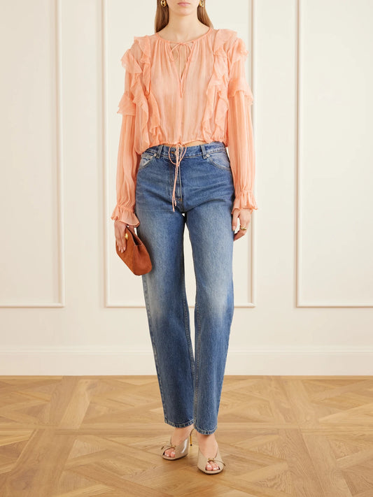Image of a model wearing Tops. Product name - Delfina Cropped Ruffled Silk-crepon Blouse in Pink colour by brand - Ulla Johnson