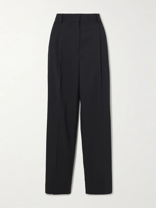 Image of a model wearing Pants. Product name - Pleated Twill Straight-leg Pants in Black colour by brand - TOTEME