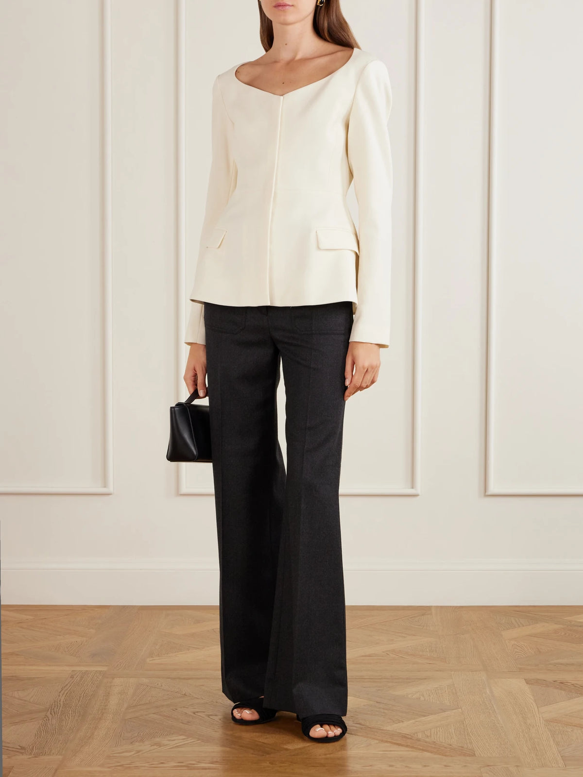 Image of a model wearing Tops. Product name - Charlotte Wool-crepe Blouse in Ivory colour by brand - LIBEROWE