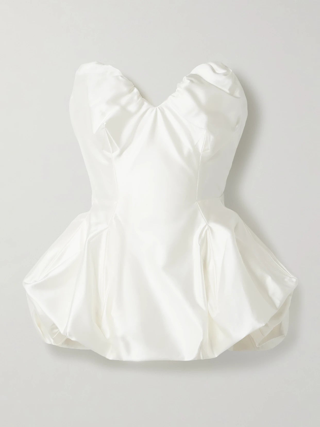 Image of a model wearing Tops. Product name - Raven Strapless Gathered Satin Bustier Top in Ivory colour by brand - Vivienne Westwood