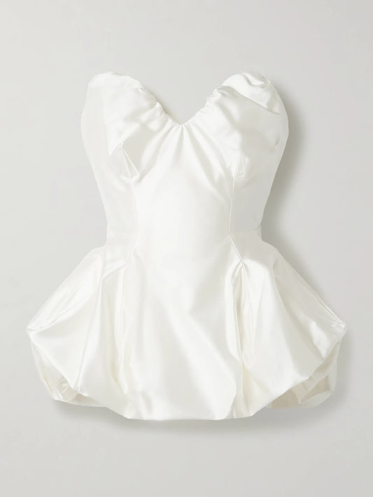 Image of a model wearing Tops. Product name - Raven Strapless Gathered Satin Bustier Top in Ivory colour by brand - Vivienne Westwood