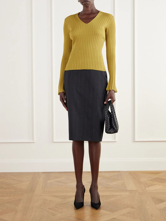 Image of a model wearing Tops. Product name - Roux Ribbed Top in Mustard colour by brand - Proenza Schouler