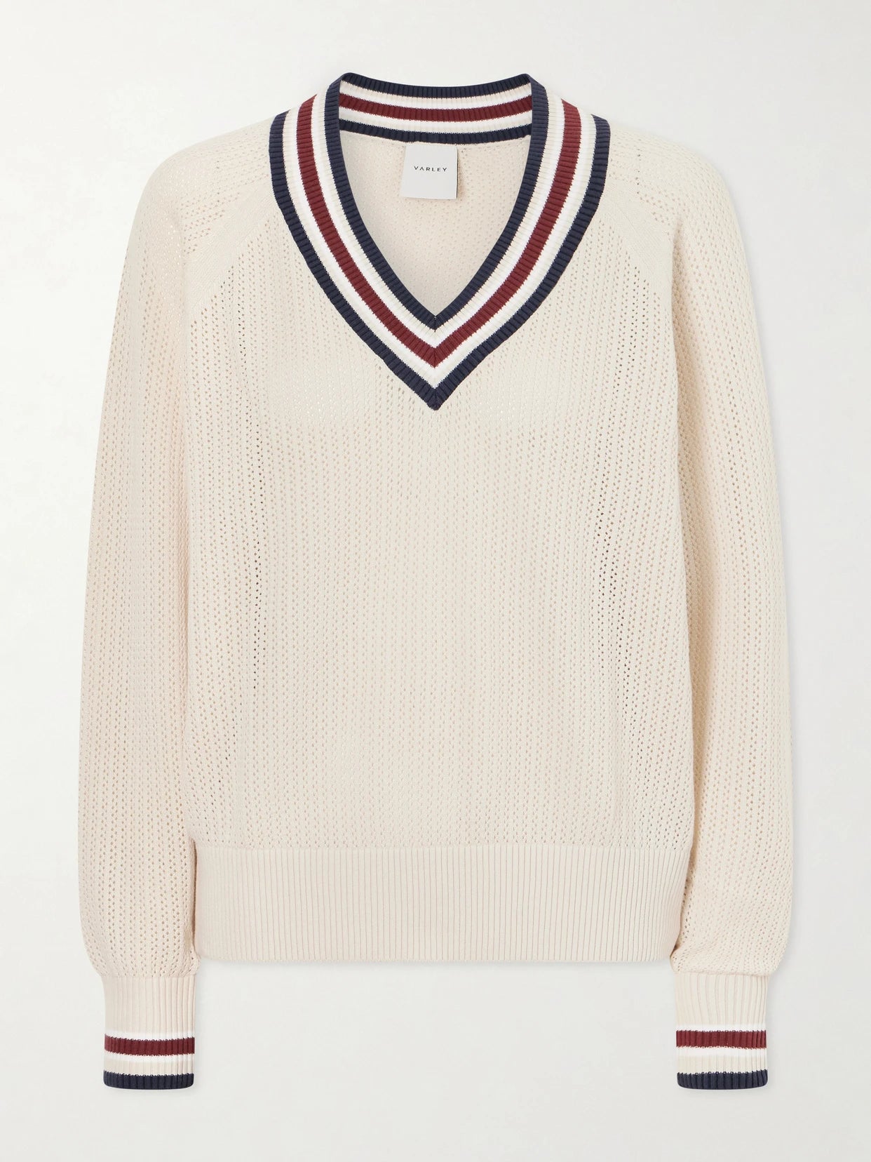 Image of a model wearing Outerwear. Product name - Open-knit Cotton Sweater in Cream colour by brand - Varley