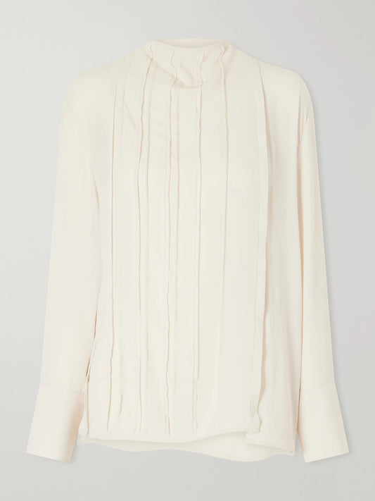 Image of a model wearing Tops. Product name - Pleated Georgette Blouse in Cream colour by brand - Victoria Beckham