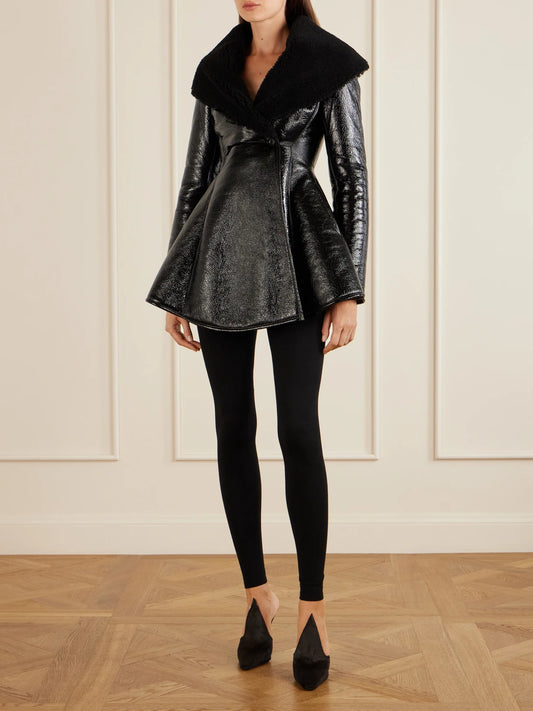Image of a model wearing Pants. Product name - High-rise Wool-blend Leggings in Black colour by brand - Alaïa